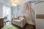 Slaapkamer met fotobehang met close-up van pluizige paardebloem